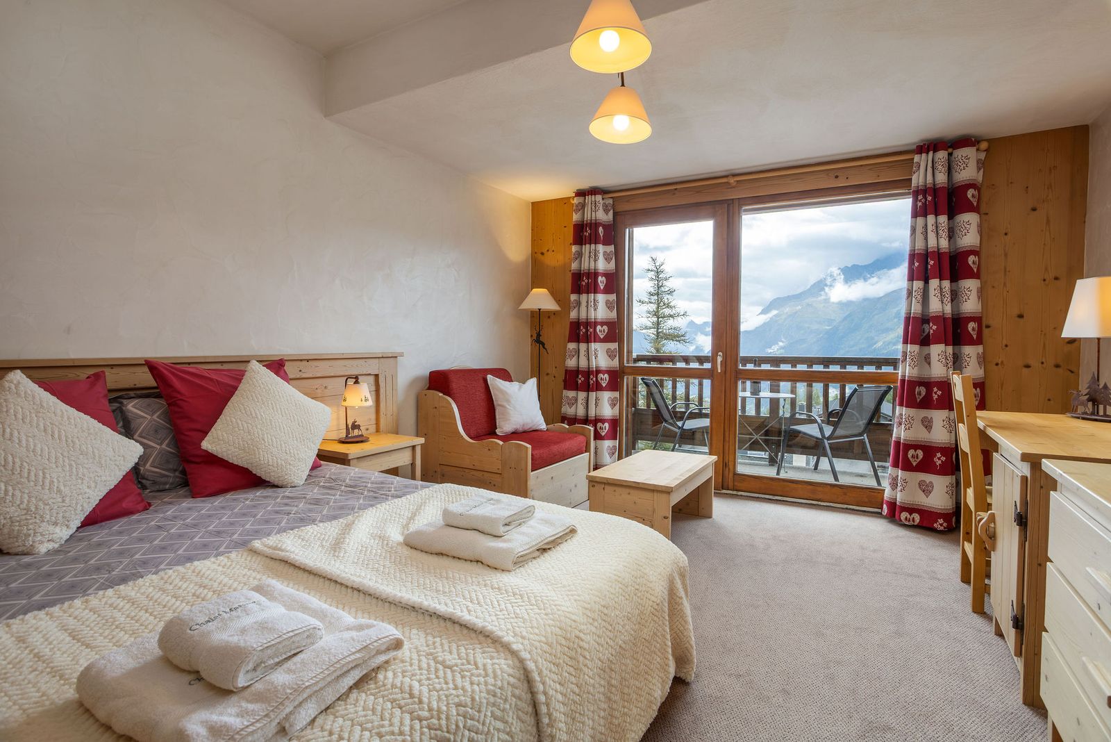 South-facing master bedroom with balcony and valley view